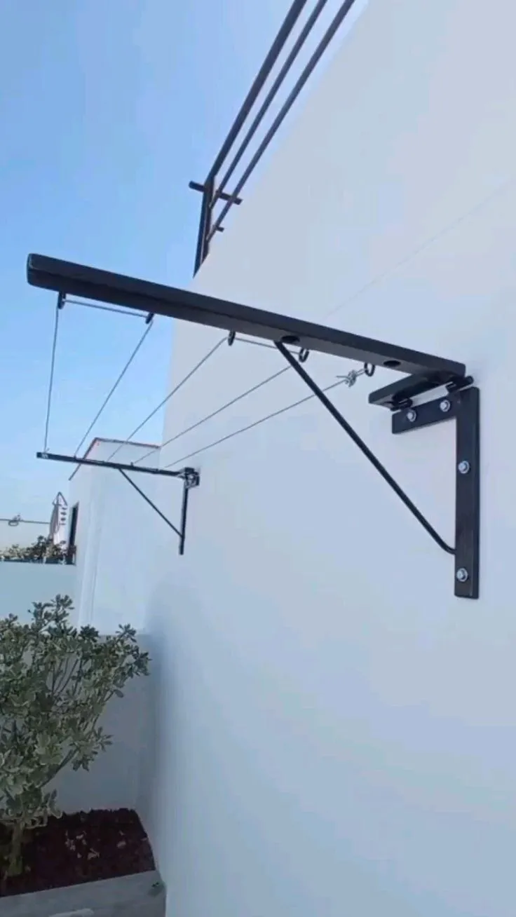 Tendedero abatible de herrería instalado en muro exterior – tendederos plegables por mayoreo en Chihuahua